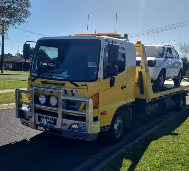 Gold Car Removals tow truck collecting a sold car from a Melbourne street