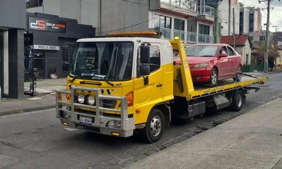 Free car removal in Melbourne – car loaded onto a Gold Car Removals tow truck